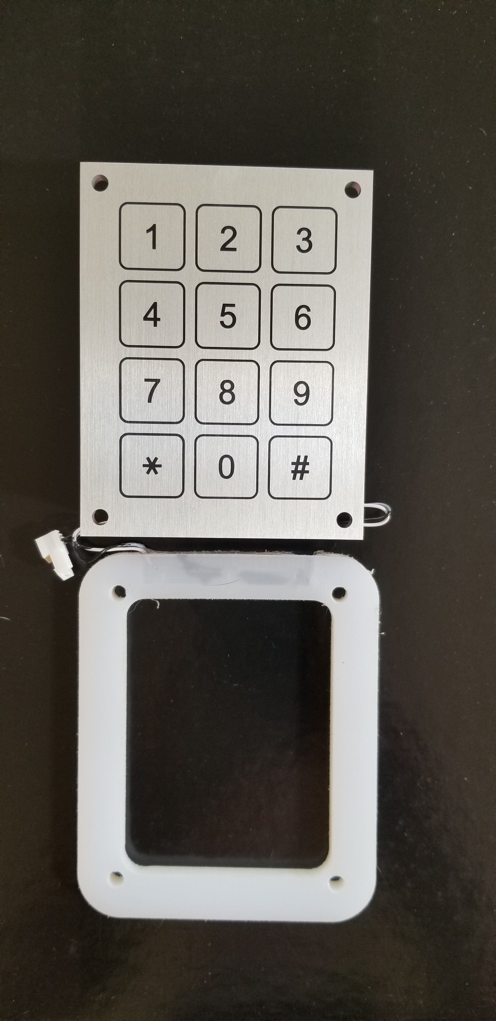 A Close-up of a Metal Door Featuring a Digital Keypad